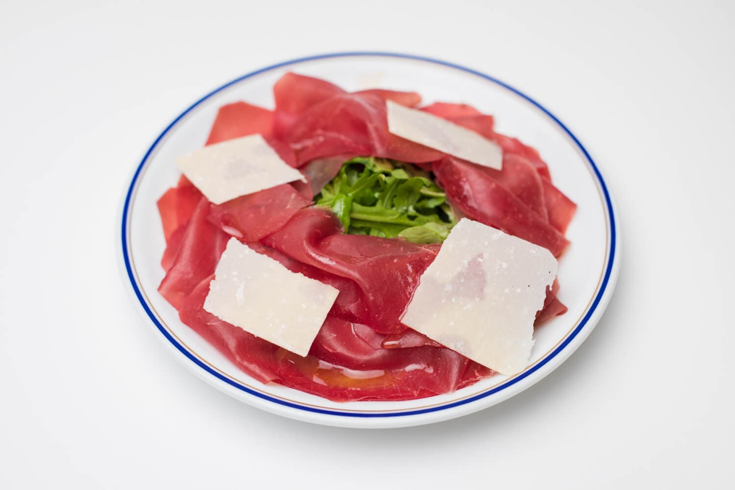 Bresaola, roquette et copeaux de parmesan - Menu item