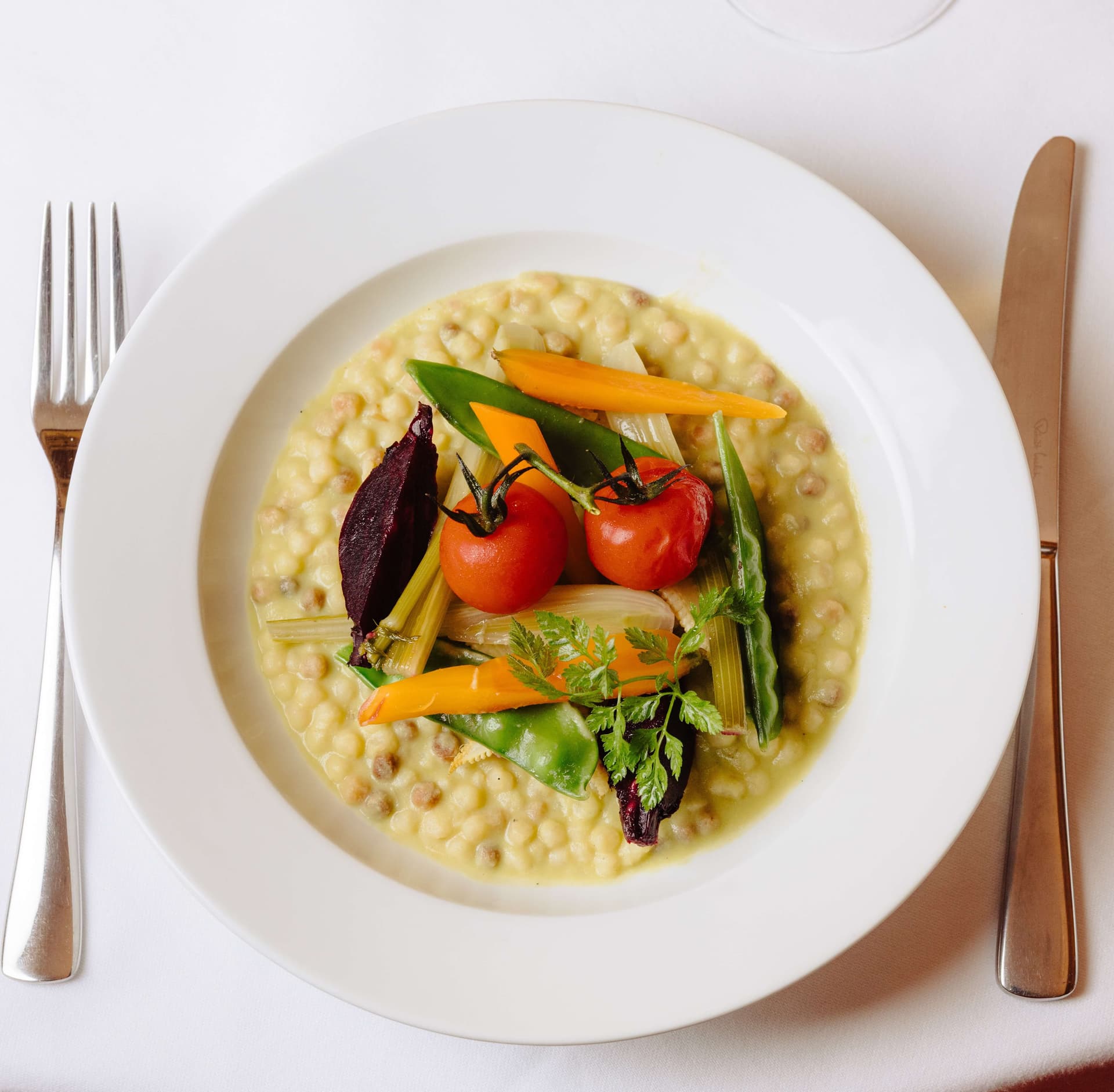 Risotto de Fregola Sarda aux légumes de saison - Menu item