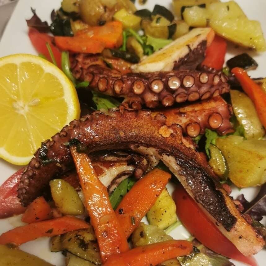 Grilled octopus, potatoes and vegetables - Menu item