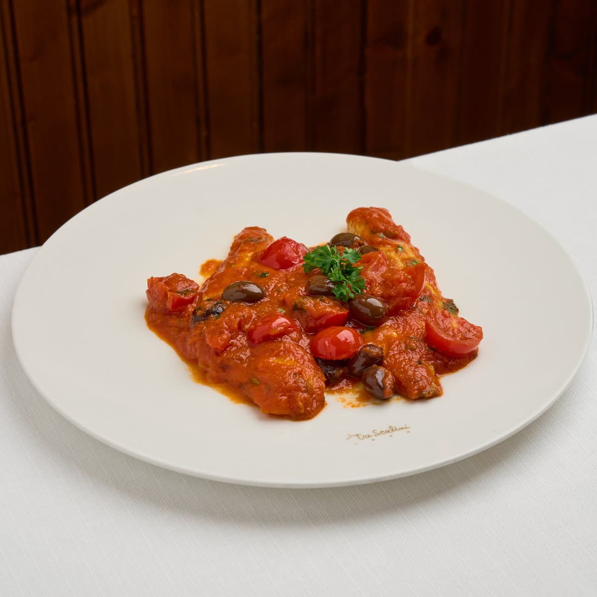 Orata con pomodorini, erbette e olive taggiasche - Menu item