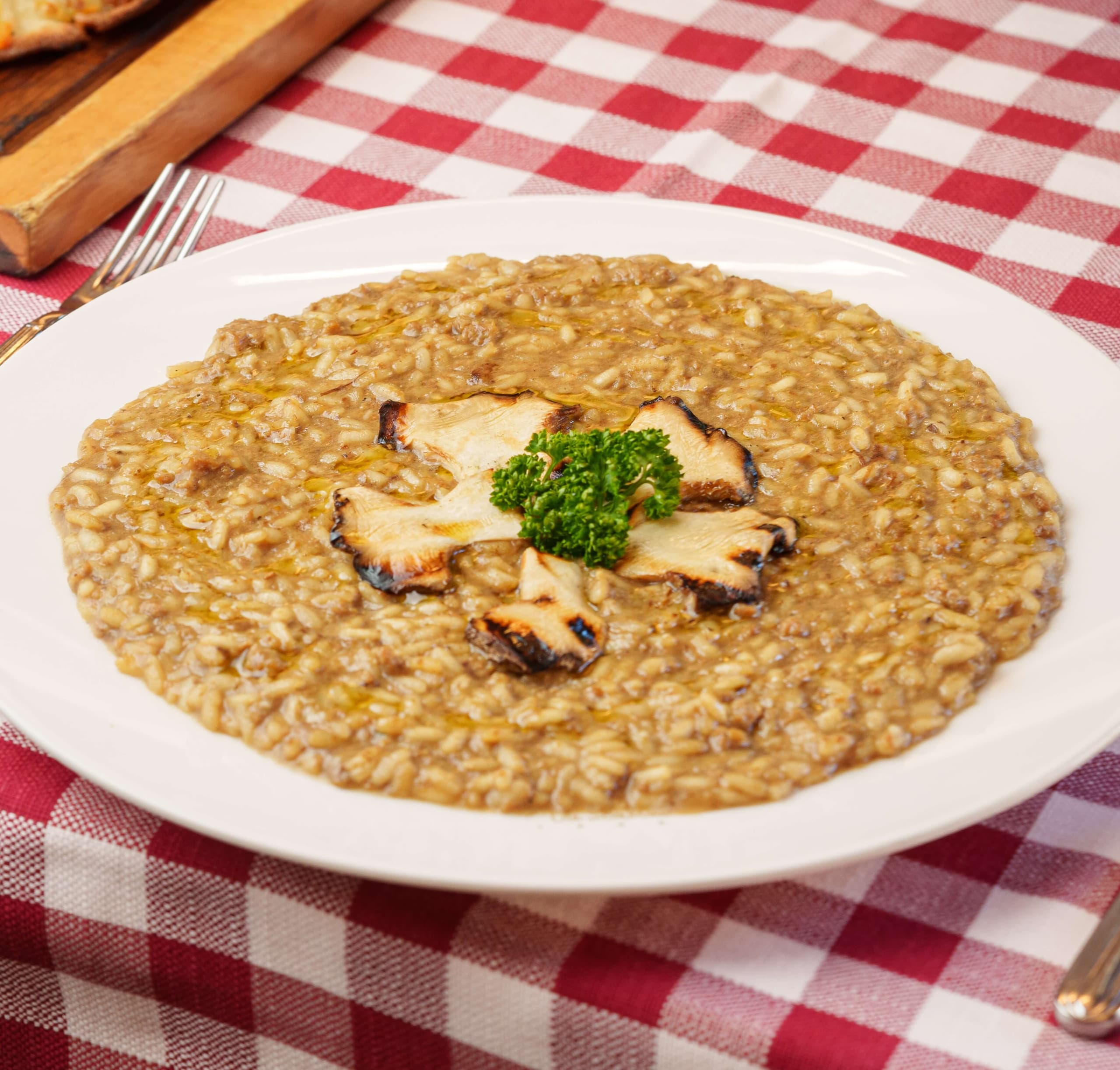 Risotto acquerello, con funghi e salsiccia - Menu item