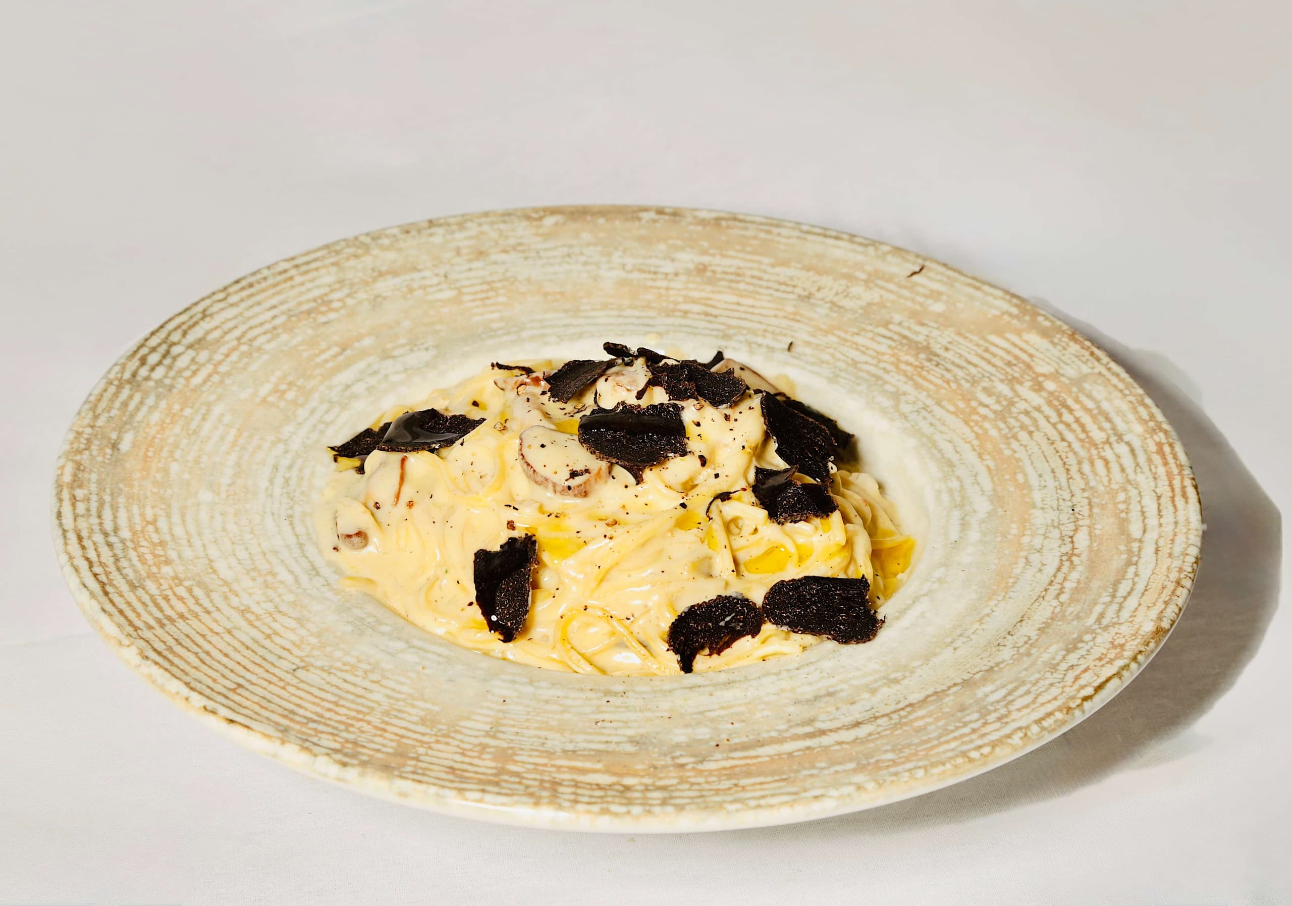 Tagliolini frais aux cèpes et truffes noires - Menu item
