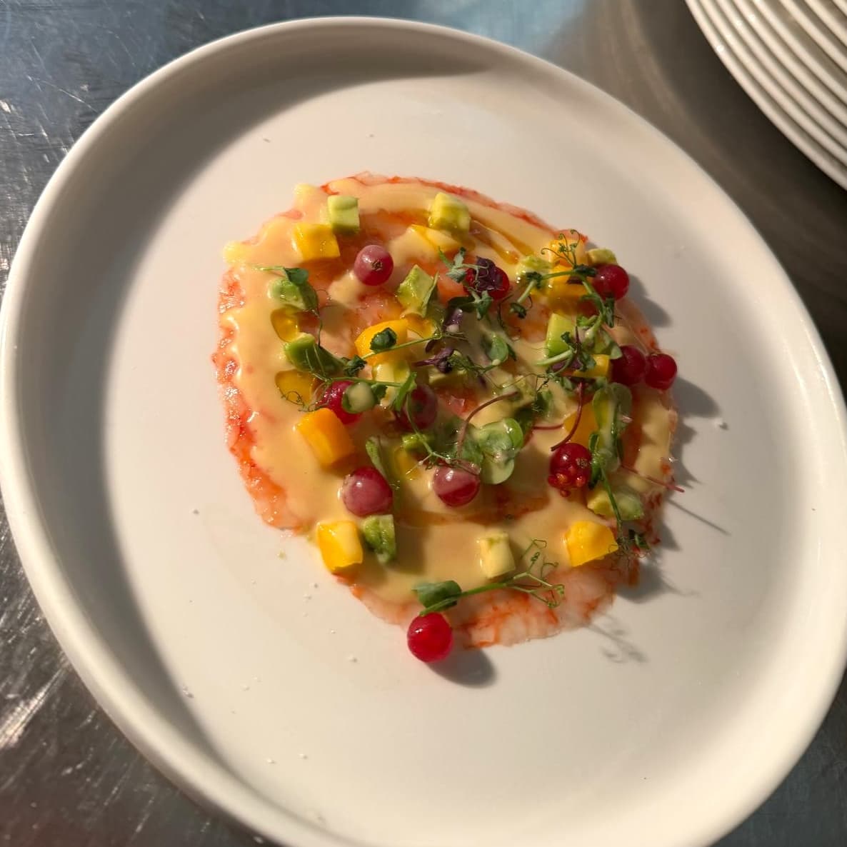 Carpaccio de Crevettes Rouge, Brunoise de Mangue, Avocat & Ribes - Menu item
