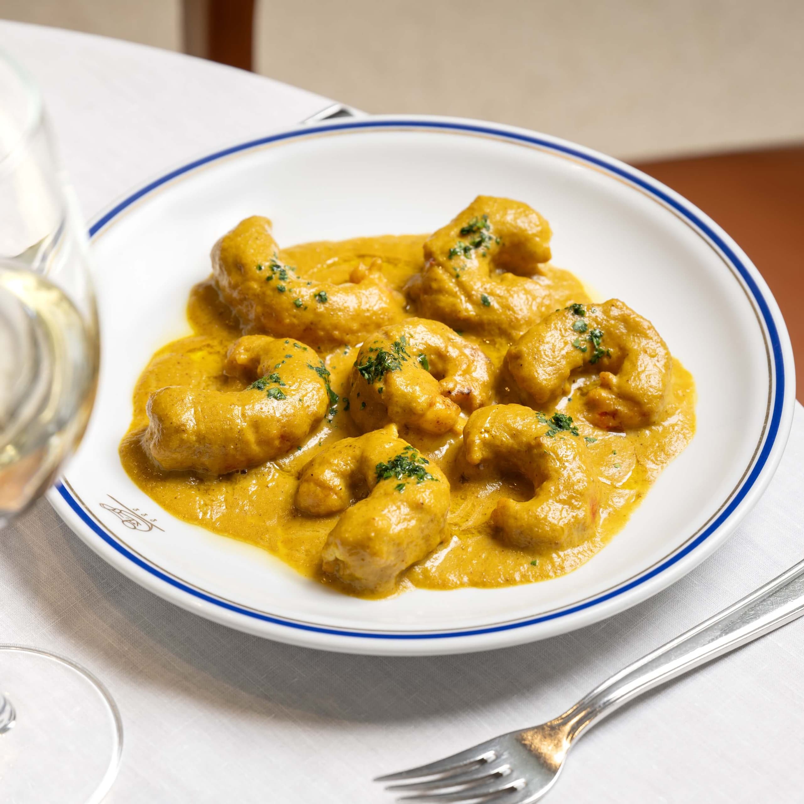 Crevettes d'Argentine, sauce curry et riz pilaf - Menu item