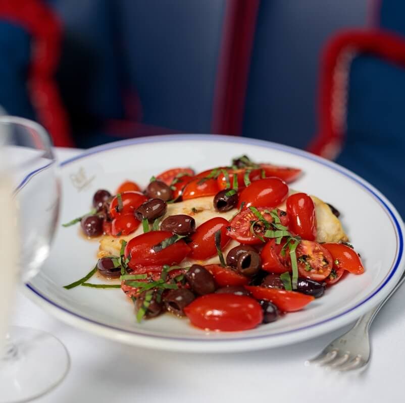 Loup de mer sauvage, tomates cerise, olives et riz pilaf - Menu item